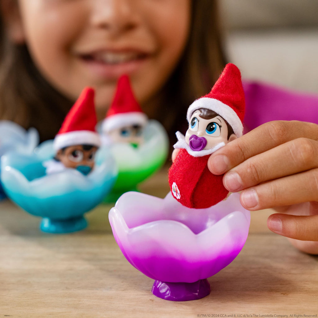 The Elf on the Shelf Frost Pips Mini Blooms Elf Baby Girl with Blue Eyes | Includes a Frost Pips Elf Baby Girl with blue eyes and Frost Flower Cradle.