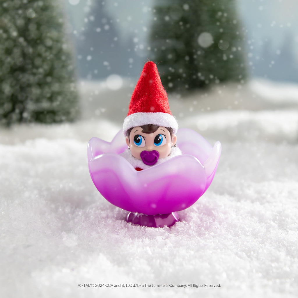 The Elf on the Shelf Frost Pips Mini Blooms Elf Baby Girl with Blue Eyes | Includes a Frost Pips Elf Baby Girl with blue eyes and Frost Flower Cradle.